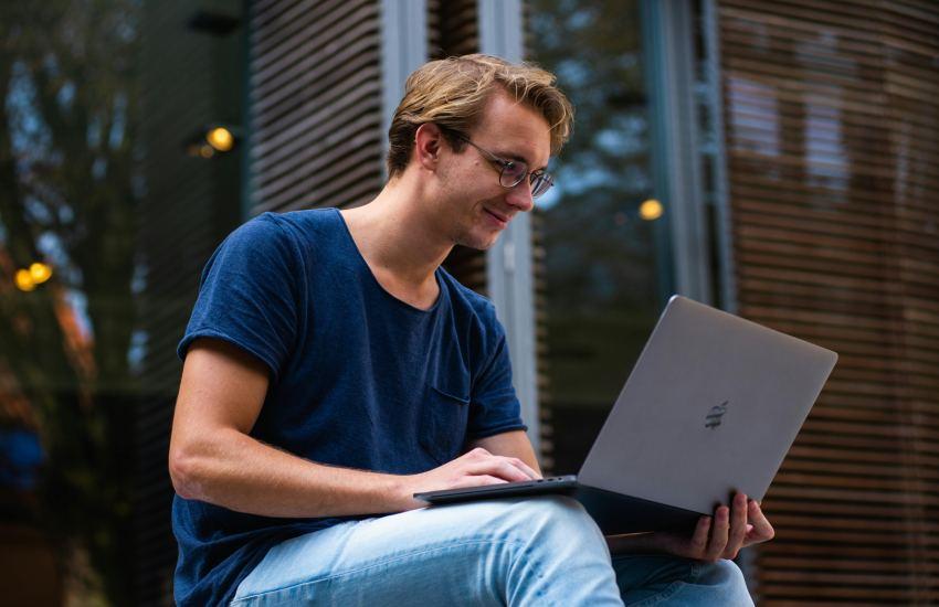 Selective Focus Photo of Man Using Laptop.
